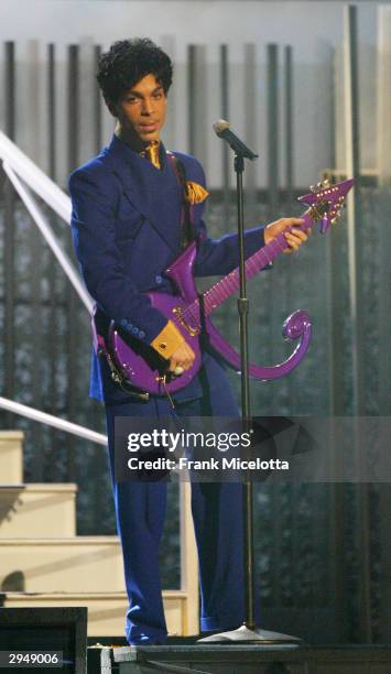 Grammy and Oscar-winning recording artist Prince performs the song "Purple Rain" at the 46th Annual Grammy Awards held at the Staples Center on...