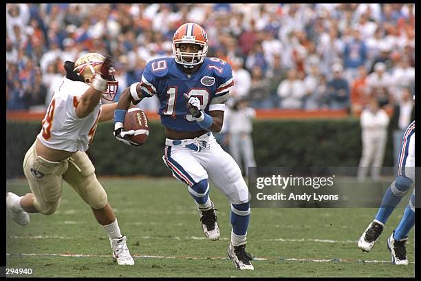 Wide receiver Ike Hilliard of the Florida Gators runs down the field during a game against the Florida State Seminoles at Florida Field in...