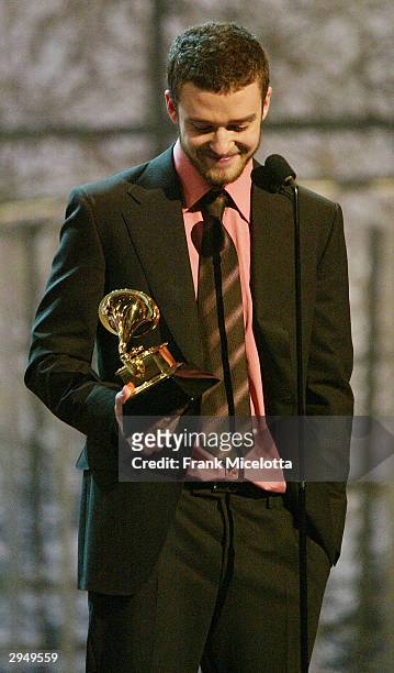 Justin Timberlake accepts the Grammy for Best Male Pop Vocal Performance for the song "Cry Me A River" on the album Justified, at the 46th Annual...