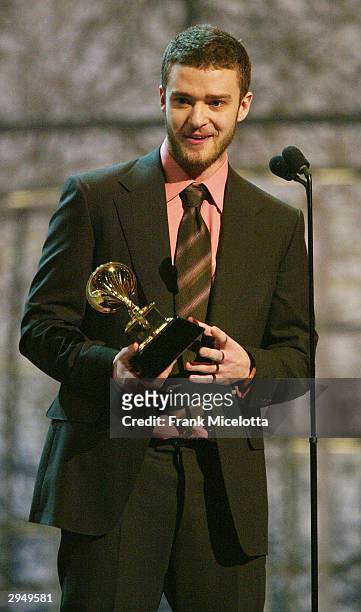 Justin Timberlake accepts the Grammy for Best Male Pop Vocal Performance for the song "Cry Me A River" on the album Justified, at the 46th Annual...