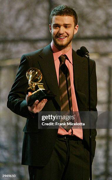 Justin Timberlake accepts the Grammy for Best Male Pop Vocal Performance for the song "Cry Me A River" on the album Justified, at the 46th Annual...