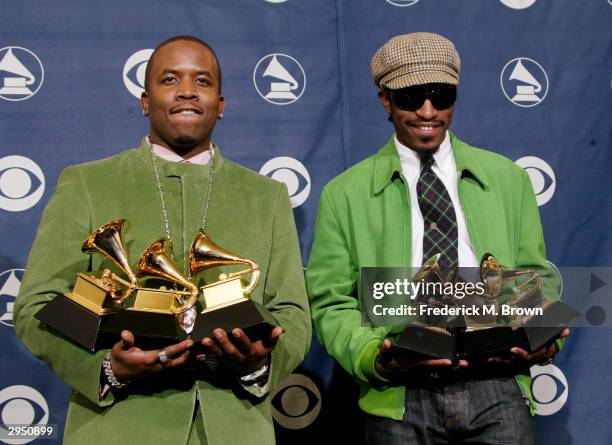 Musical Artists Big Boi and Andre 3000 of Oukast pose with their six Grammys backstage in the Pressroom at the 46th Annual Grammy Awards held on...