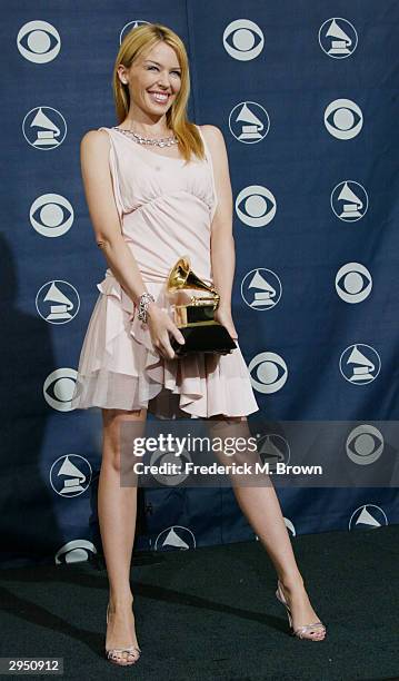 Winner of best Dance Recording Musical Artist Kylie Minogue poses backstage in the Pressroom at the 46th Annual Grammy Awards held on February 8,...