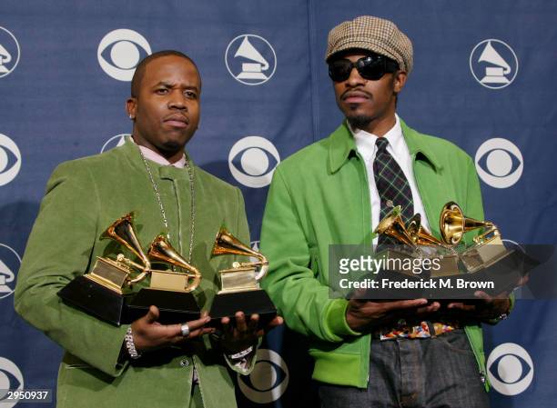 Musical Artists Big Boi and Andre 3000 of Oukast pose with their six Grammys backstage in the Pressroom at the 46th Annual Grammy Awards held on...