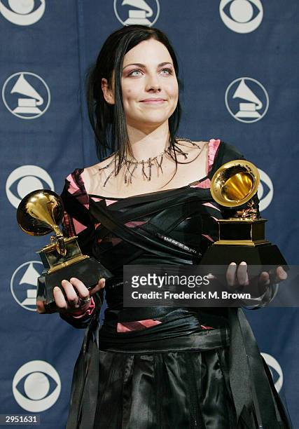 Singer Amy Lee of Evanescence poses with her two Grammys backstage in the Pressroom at the 46th Annual Grammy Awards held at the Staples Center on...