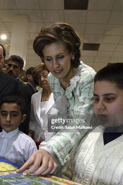 Asmaa al-Assad, wife of the Syrian President attends the first national childhood conference, February 8, 2004 in Aleppo in the north of Syria. The...