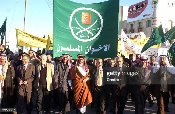 Members of Jordan's Muslim Brotherhood group lead a demonstration by around 600 people in the Jordanian capital Amman 09 February 2004 against the...