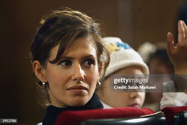 Asmaa al-Assad, wife of the Syrian President attends the first national childhood conference, February 9, 2004 in Aleppo in the north of Syria. In...