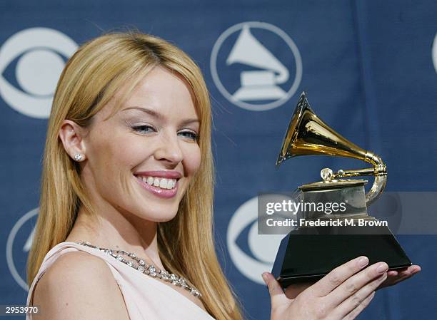 Winner of best Dance Recording Musical Artist Kylie Minogue poses backstage in the Pressroom at the 46th Annual Grammy Awards held on February 8,...