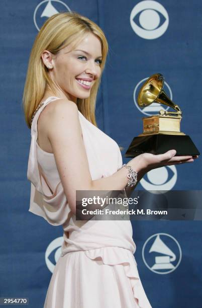 Winner of best Dance Recording Musical Artist Kylie Minogue poses backstage in the Pressroom at the 46th Annual Grammy Awards held on February 8,...