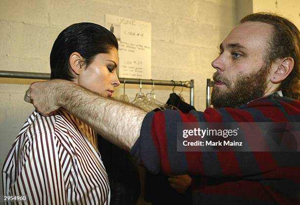 Fashion designer Frazer Harmon prepares for the runway backstage during the Harmon Fall 2004 fashion show at MAO/Atlas during the Olympus 2004...