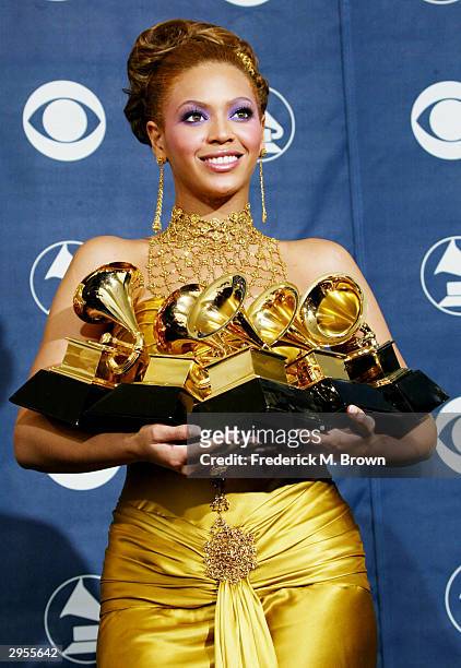 Singer Beyonce Knowles poses with her six Grammys backstage in the Pressroom at the 46th Annual Grammy Awards held at the Staples Center on February...