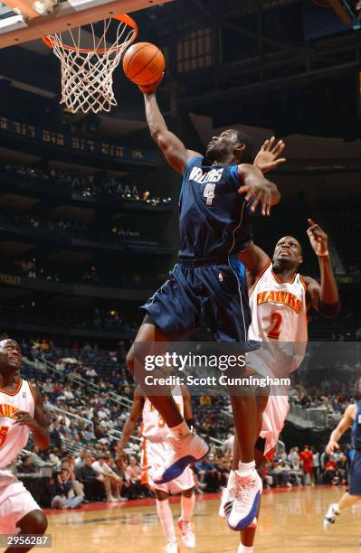 Michael Finley of the Dallas Mavericks drives for a dunk attempt against the Atlanta Hawks February 9, 2004 at Philips Arena in Atlanta, Georgia....