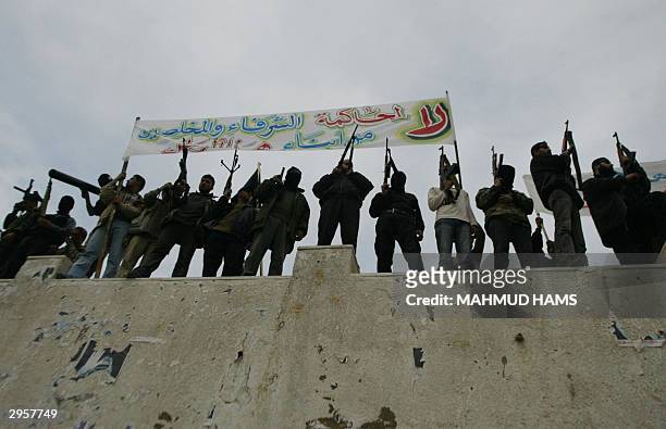 Armed members from the Populer Resistance Committees demonstrate 10 February 2004 in Gaza City against the arrest of four of their comrads who were...