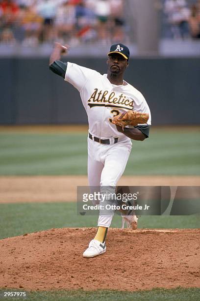 Pitcher Dave Stewart of the Oakland Athletics delivers the ball during a 1989 American League season game at the Oakland-Alameda County Coliseum in...