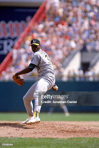 Pitcher Dave Stewart of the Oakland Athletics winds up to deliver a pitch during a 1989 American League season game at the Oakland-Alameda County...