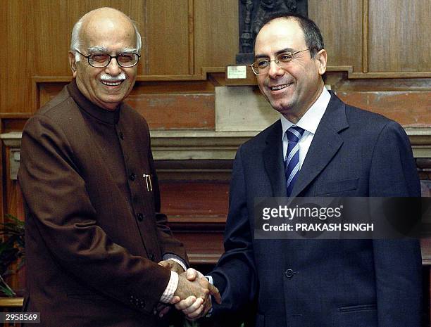 Israel's Deputy Prime Minister and Minister for Foreign Affairs Silvan Shalom and Indian Deputy Prime Minister L. K. Advani shake hands prior to a...