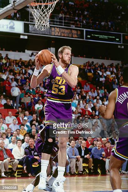 Mark Eaton of the Utah Jazz grabs a rebound during an NBA game circa 1993. NOTE TO USER: User expressly acknowledges and agrees that, by downloading...