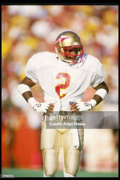 Cornerback Deion Sanders of the Florida State Seminoles stands on the field during a game against the Florida Gators at Florida Field in Gainesville,...