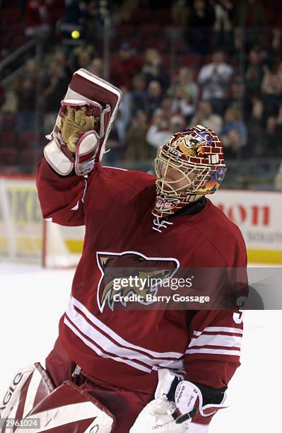 Brian Boucher of the Phoenix Coyotes waves to the fans after defeating the Los Angeles Kings on December 31, 2003 at Glendale Arena in Glendale,...