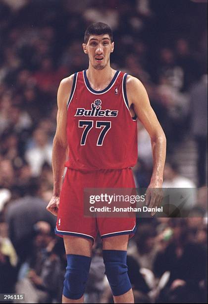 Center Gheorghe Muresan of the Washington Bullets walks down the court during a game against the Chicago Bulls at the United Center in Chicago,...