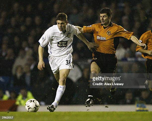 James Milner of Leeds clashes with Denis Irwin of Wolves during the FA Barclaycard Premiership match between Leeds United and Wolverhampton Wanderers...