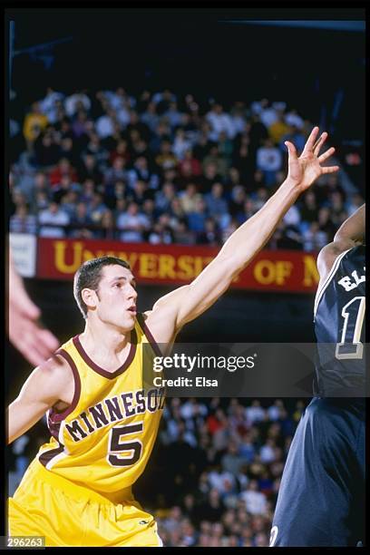 Forward Sam Jacobson of the Minnesota Golden Gophers tries to block the shot of guard Alan Eldridge of the Purdue Boilermakers at the Williams Arena...