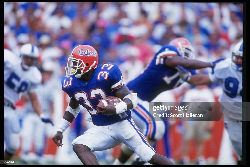 Eric Rhotty Running back Erict Rhett of the Florida Gators runs down the field ...