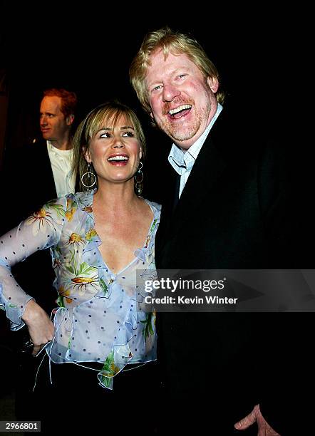 Actress Maura Tierney and director Donald Petrie arrive at the premiere of "Welcome to Mooseport" at the Village Theater on February 10, 2004 in Los...