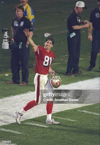 Wide receiver Ed McCaffrey of the San Francisco 49ers waves to the crowd after the 49ers victory against the San Diego Chargers at Super Bowl XXIX at...