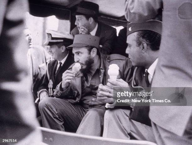 Cuban president Fidel Castro eats an ice cream cone as he rides in the Bronx Zoo train, New York City, April 2. 1959.