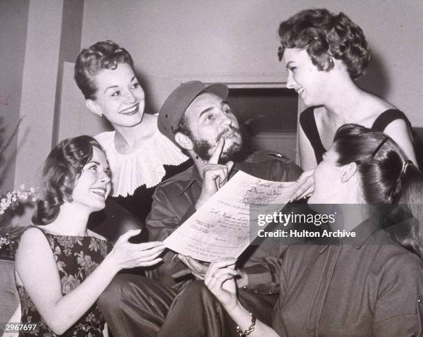 Cuban leader Fidel Castro is presented with an invitation to the New York Press Photographer's Ball, New York City, April 23, 1959.