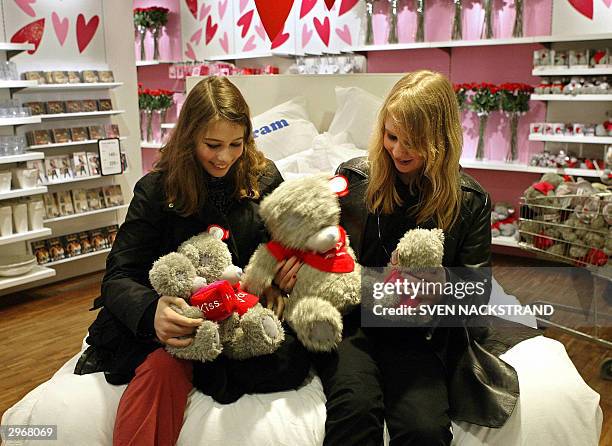 Two young women play with Valentine bears on a bed in a department store in Stockholm, 11 February 2004. Valentines day, "Alla Hjartans Dag" in...