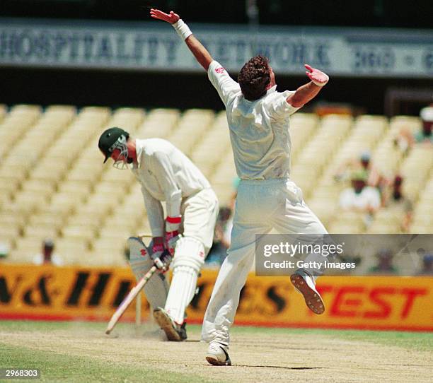 Fanie de Villiers of South Africa celebrates an historic win after taking the wicket of Glenn McGrath of Australia during the Second Test match...