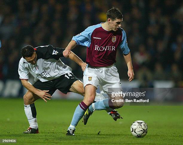 Steed Malbranque of Fulham tries to tackle Gareth Barry of Aston Villa during the FA Barclaycard Premiership match between Fulham and Aston Villa at...