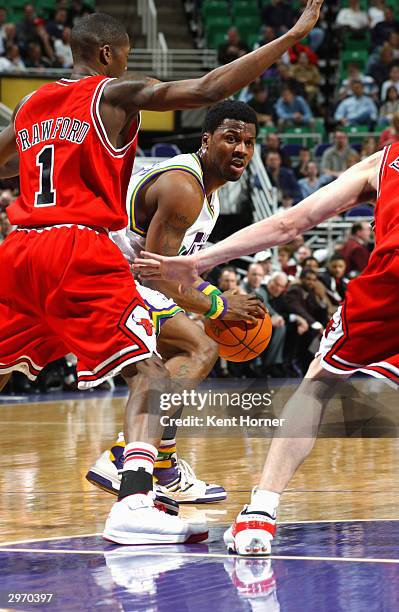 DeShawn Stevenson of the Utah Jazz holds the ball as he is covered by Jamal Crawford of the Chicago Bulls during the game on February 4, 2004 at the...