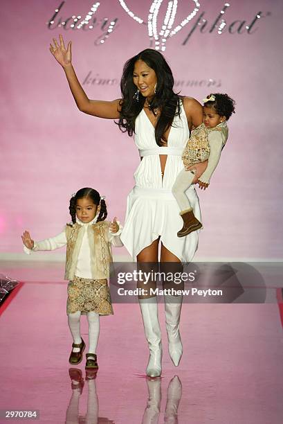 Designer Kimora Lee Simmons closes the runway at the Baby Phat fashion show during Olympus Fashion Week at Gotham February 11, 2004 in New York City.