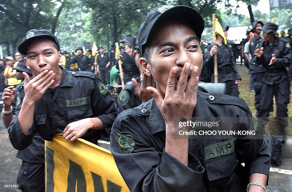 Black uniformed Indonesian supporters of