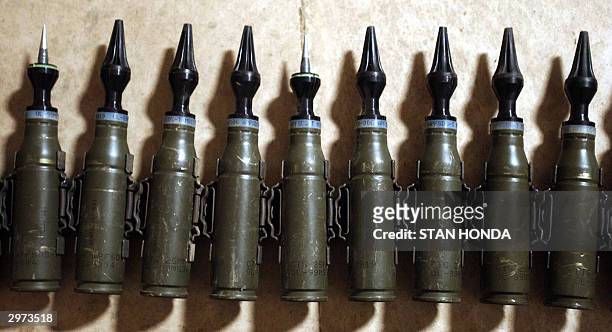 Row of US Army 25mm rounds of depleted uranium ammunition, 11 February 2004, at the base of Charlie Company, 1-22 Battalion, 4th Infantry Division,...