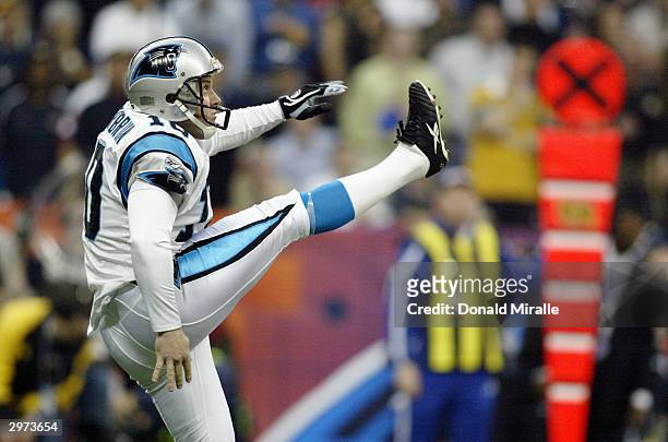 Punter Todd Sauerbrun of the Carolina Panthers kicks the ball against the New England Patriots during Super Bowl XXXVIII at Reliant Stadium on...
