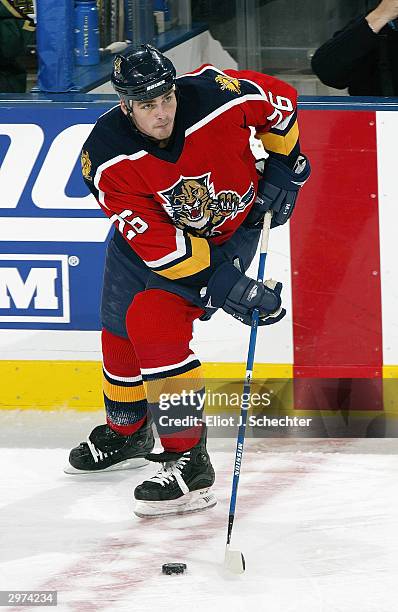 Defender Mike Van Ryn of the Florida Panthers stickhandles and looks to make a play with the puck from the red line against the Dallas Stars on...