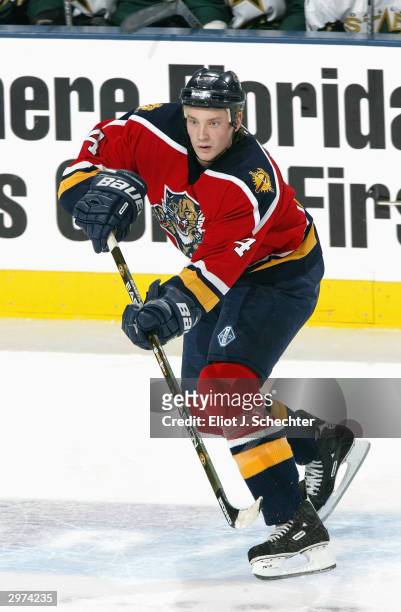 Defender Jay Bouwmeester of the Florida Panthers follows through on a pass during the game against the Dallas Stars on December 19, 2003 at the...