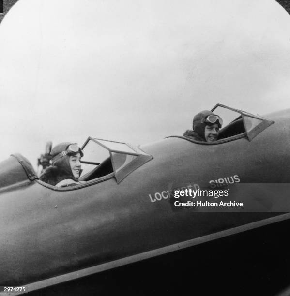 American aviators Charles A. Lindbergh and his wife and navigator Annie Morrow Lindbergh in a Lockheed Sirus monoplane during their flight from the...