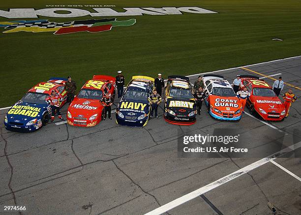 The U.S. Military-sponsored NASCAR teams line up for group photo at the NASCAR Nextel Cup Daytona 500 on February 12, 2004 at Daytona International...