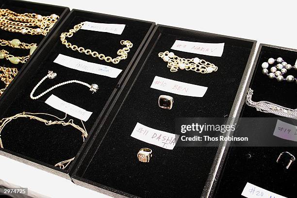 Pieces of jewelry lie on a table backstage at the Jeffrey Chow Fall 2004 during Olympus Fashion Week February 12, 2004 in New York City.