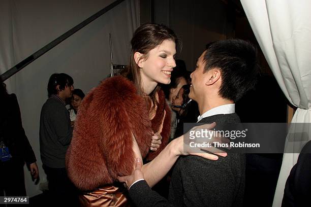 Designer Jeffrey Chow talks with a model backstage at the Jeffrey Chow Fall 2004 during Olympus Fashion Week February 12, 2004 in New York City.