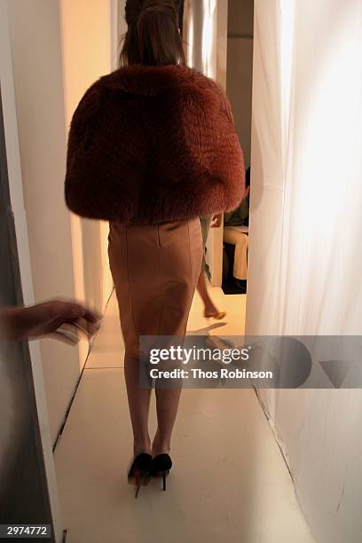 Model waits backstage at the Jeffrey Chow Fall 2004 during Olympus Fashion Week February 12, 2004 in New York City.