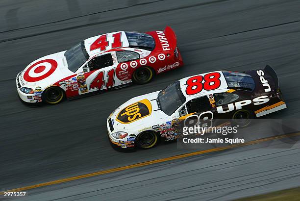 Casey Mears, driver of the Target Chip Ganassi Racing Dodge Intrepid, races alongside Dale Jarrett, driver of the UPS Ford Taurus, during the...