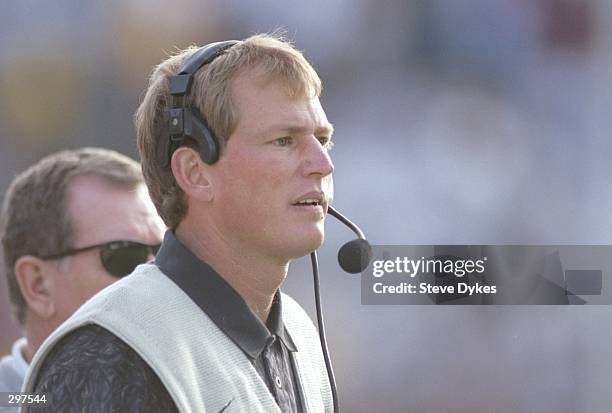 Coach Rick Neuheisel of the Colorado Buffaloes watches his players during a game against the Iowa State Cyclones at Folsom Field in Boulder,...