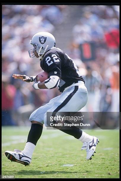 Running back Roger Craig of the Los Angeles Raiders runs down the field during a preseason game against the Indianapolis Colts at the Los Angeles...